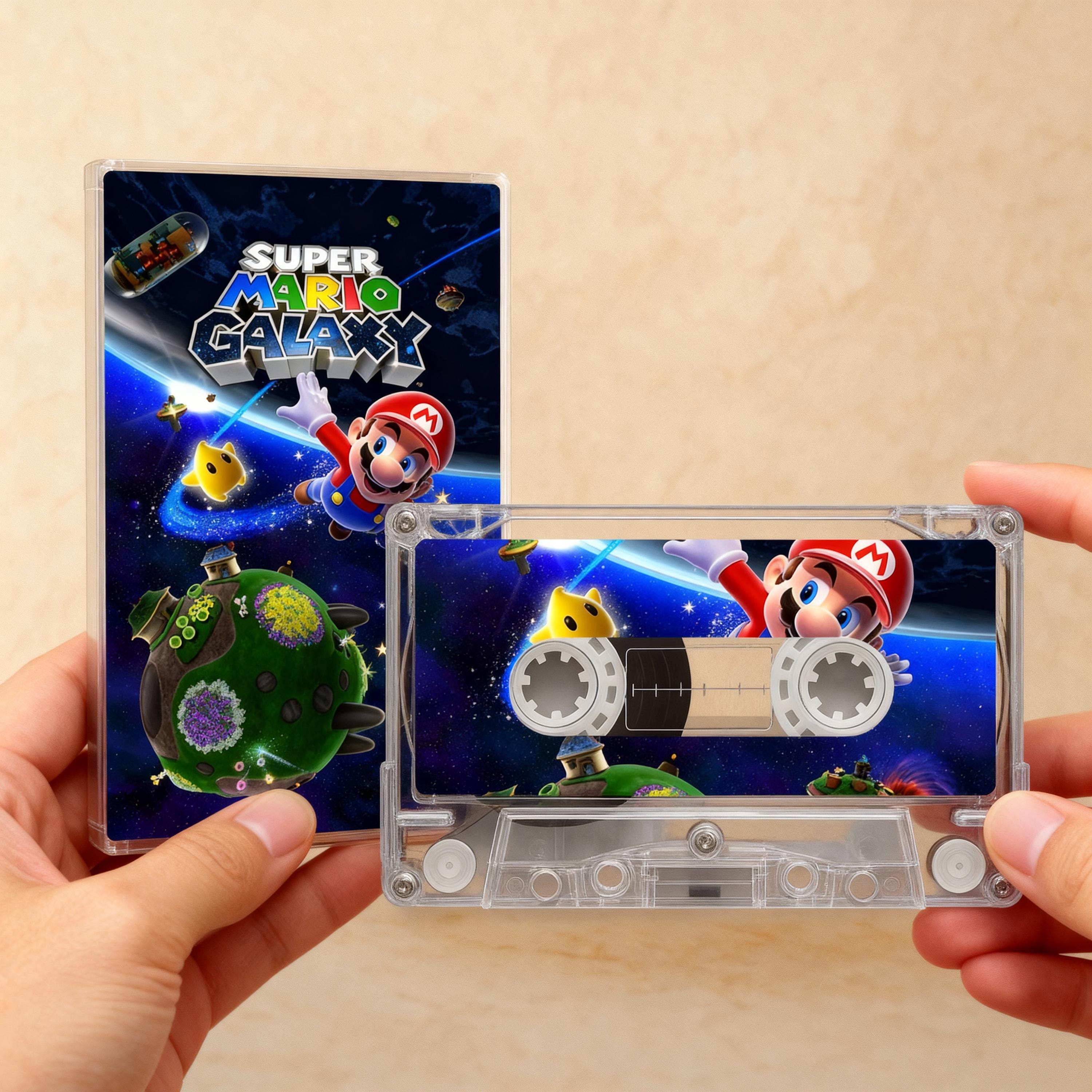 A person is holding a CD case for the video game Super Mario Galaxy, which features a space theme with Mario and other characters.