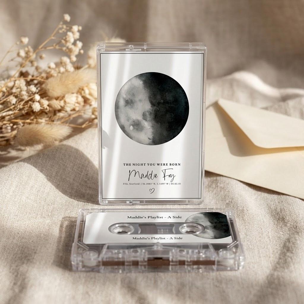 a music album cover with a moon image, a cassette tape, and a white envelope on a beige background.
