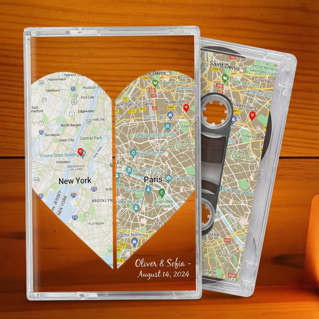 a heart-shaped map of New York and Paris, with the names "Oliver & Sofia" and the date "August 14, 2014" written on it. The map is displayed on a clear case, which also has a cassette tape attached to it.