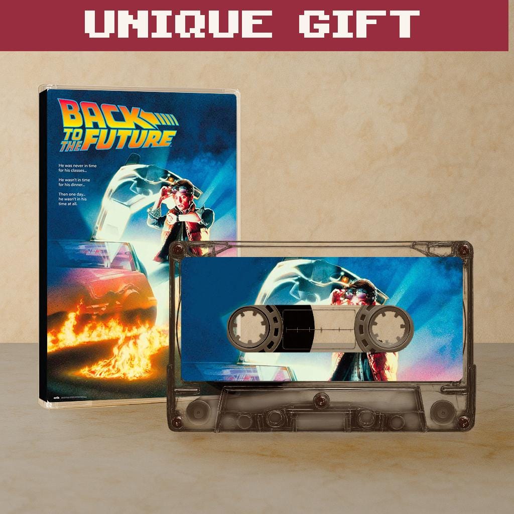 a cassette tape and a poster for the movie "Back to the Future".