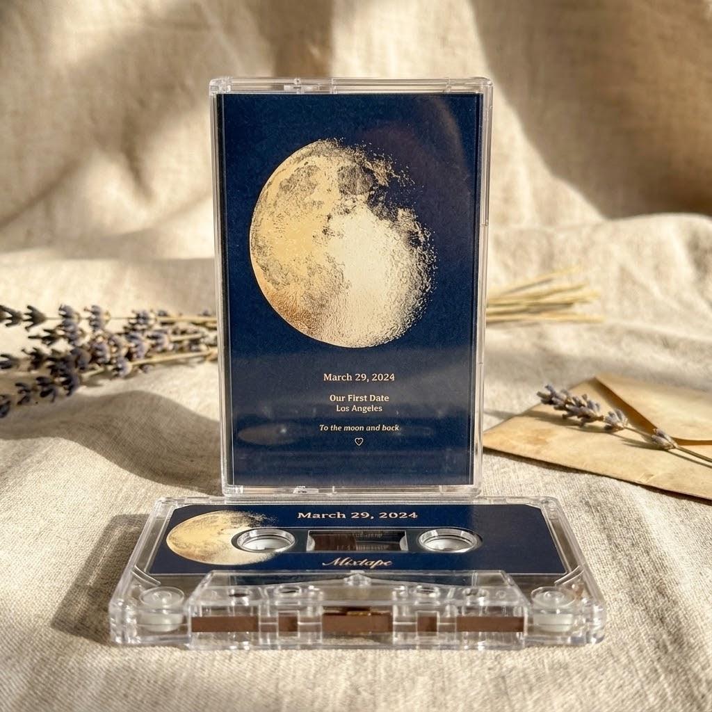 a music cassette case with a moon image on it, placed on a beige cloth surface. The cassette case has a label that reads "March 29, 2024" and "Dulcieza in Los Angeles to the moon and back".